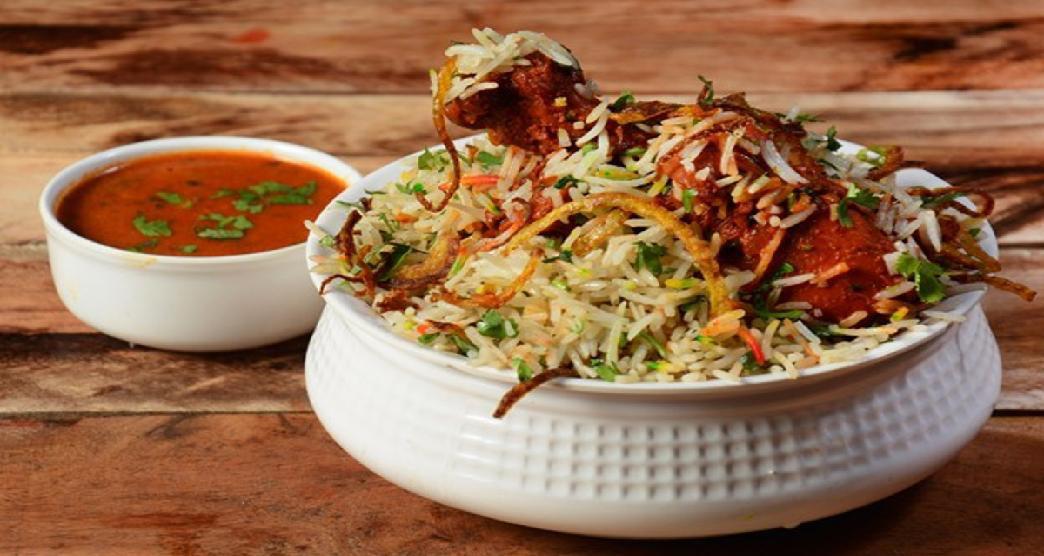 A bowl of Hyderabadi biryani with mirchi ka salan