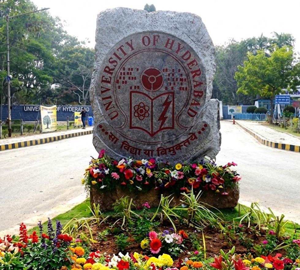 University of Hyderabad entrance sign with campus grounds